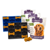 Dog treat packaging including a tray, bags of dog biscuit mix, and a small wooden dog toy on a white background.